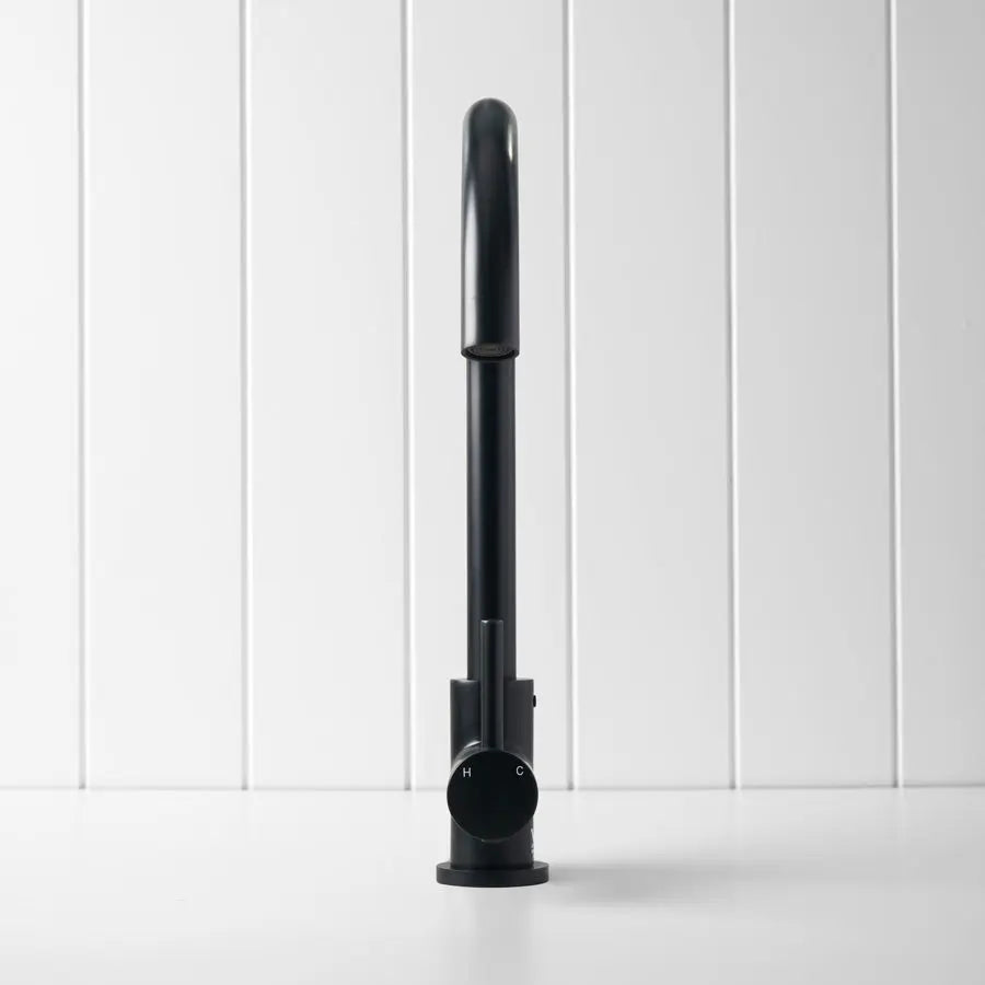 Black cylindrical object on a white background