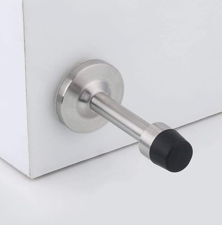 Metallic door handle on a white door