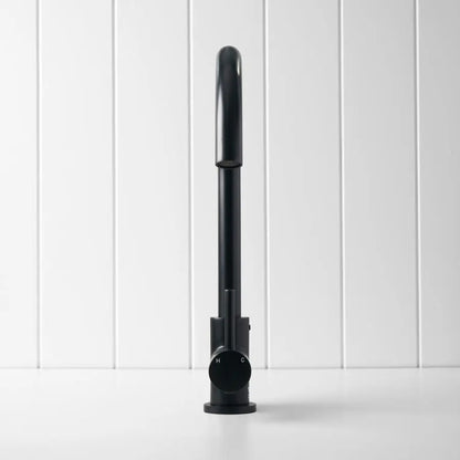 Black cylindrical object on a white background
