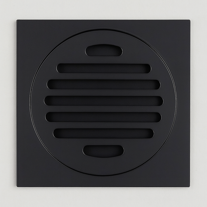 Black square drain cover with circular center on a light gray background